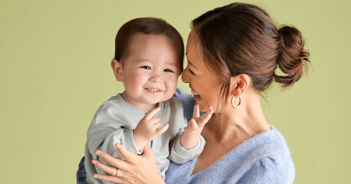 A mom laughing with her baby - Baby looking at camera - Little Bellies
